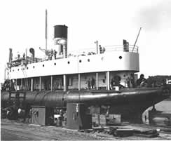 The S.S. Meteor's crew making repairs at dock.